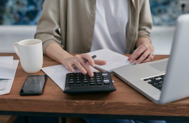 Person calculating financial report